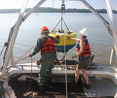 The CBIBS team deploys the base, or "hull," of the new buoy